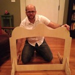 David Glicksman, playing with doll furniture
